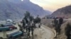 FILE - Trucks loaded with goods are seen parked at border crossing point Torkham in Afghanistan's eastern Nangarhar province, on the country's border with Pakistan, Feb. 21, 2023.
