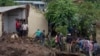 Malawi defense force soldiers work with community members to recover bodies of victims of landslides after heavy rains from Cyclone Freddy in Blantyre, Malawi, March 16, 2023. 