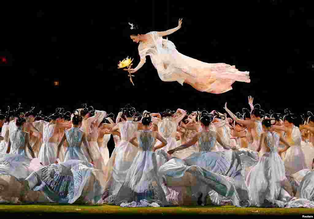 Artists perform during the closing ceremony of the 19th Asian Games in Hangzhou, China.