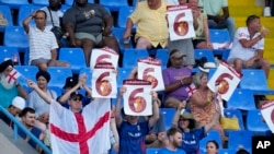Cricket fans attend an ICC Men's T20 World Cup cricket match between Namibia and England at Sir Vivian Richards Stadium in North Sound, Antigua and Barbuda, June 15, 2024.
