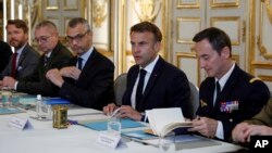 France's President Emmanuel Macron, 2nd right, chairs a security and defense council at the Elysee Palace in Paris, May 20, 2024. 