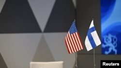 美国与芬兰国旗。（路透社照片）