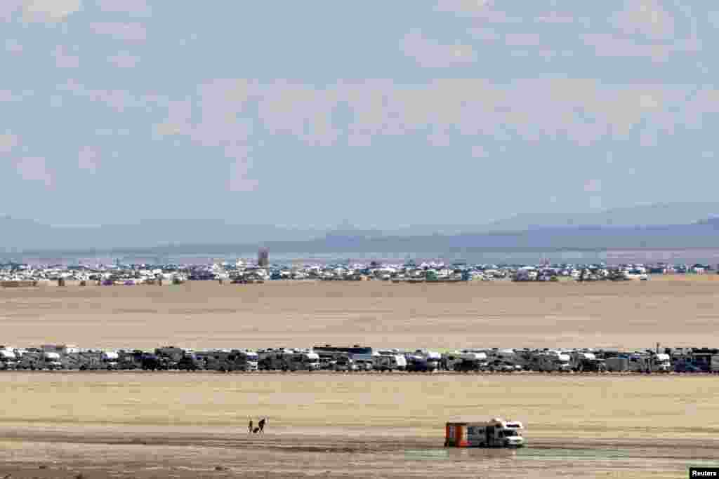 Vehicles are seen departing the Burning Man festival in Black Rock City, Nevada, Sept. 4, 2023. 