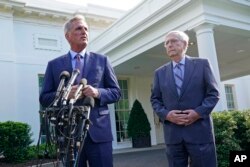 FILE - House Speaker Kevin McCarthy of California, left, next to Senate Minority Leader Mitch McConnell of Kentucky, speaks to reporters outside of the White House, May 9, 2023.