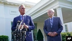 FILE - House Speaker Kevin McCarthy of Calif., left, next to Senate Minority Leader Mitch McConnell of Ky., right, speaks to reporters outside of the White House, May 9, 2023.
