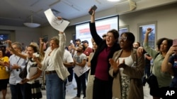 FILE- Voters celebrate the defeat of Issue 1 during a party, Aug. 8, 2023, in Columbus, Ohio. Ohio voters rejected a GOP measure that would have made it difficult to pass abortion protections.