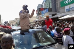 Kenyan opposition leader Raila Odinga speaks to supporters on a street in the Eastleigh neighborhood of Nairobi, Kenya, March 20, 2023.