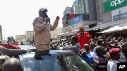 FILE: Kenya opposition leader Raila Odinga speaks to supporters on a street in the Eastleigh neighborhood of Nairobi, Kenya, March 20, 2023. 