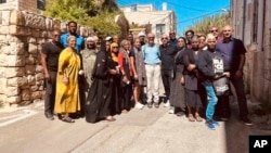 FILE - In this photo provided by Black Jerusalem, members of the “Black Jerusalem” trip pose for a photograph in the Ein Karem neighborhood of Jerusalem, on Sept. 29, 2023.