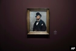 A portrait of Leon Monet by his brother Claude Monet hangs on display as part of an exhibition illuminating the hitherto unknown role Leon played in the role of his brother Claude's life and art, at the Musée du Luxembourg in Paris, Monday, March 13, 2023. (AP Photo/Lewis Joly)