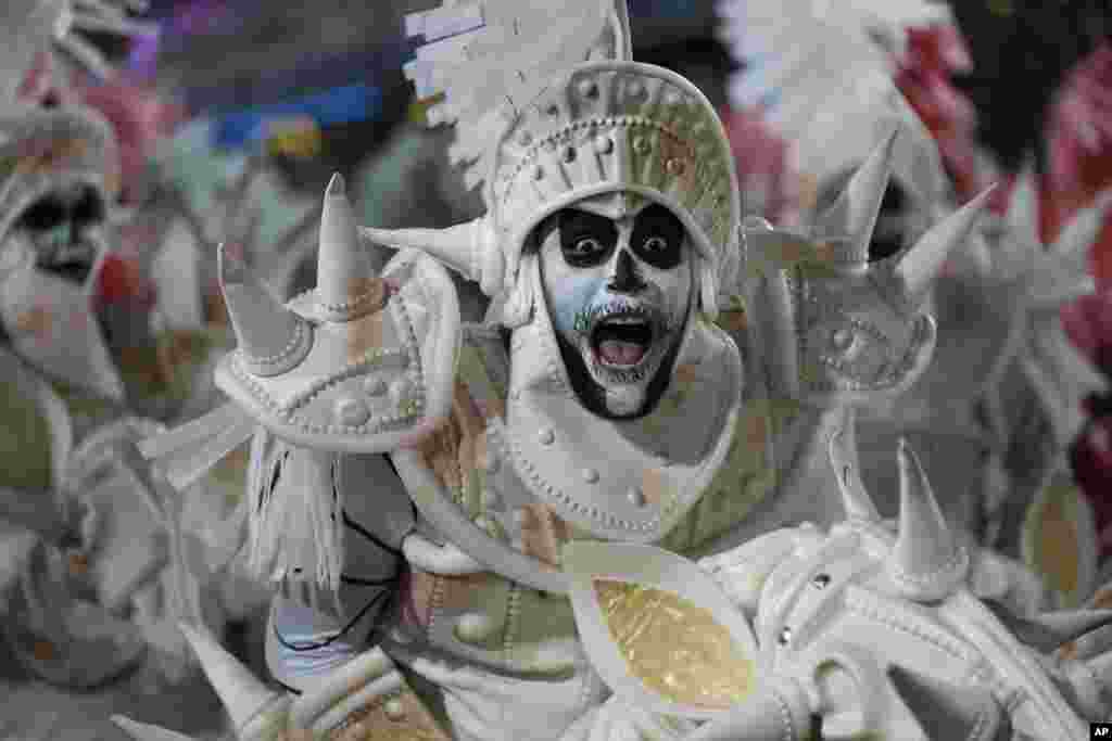 Performers from the Salgueiro samba school parade during Carnival celebrations at the Sambadrome in Rio de Janeiro, Brazil.