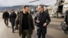 FILE - Ukrainian President Volodymyr Zelenskyy is welcomed by Switzerland's Foreign Minister Ignazio Cassis, Jan. 15, 2024, at Airport Bern Belp, Switzerland.