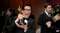 Ke Huy Quan poses with his award for best performance by an actor in a supporting role for 'Everything Everywhere All at Once' at the Governors Ball after the Oscars on March 12, 2023, at the Dolby Theatre in Los Angeles.