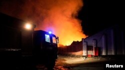 A fire truck is seen at a site of a fire in the aftermath of an attack as Starokostiantyniv, Khmelnytskyi Region, in this handout photo released Aug. 6, 2023. (Khmelnytskyi region administration/Handout via Reuters)