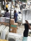 People sell air conditioners on the street in Lagos, Nigeria, July 15, 2024.