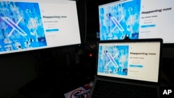 FILE - Screens display the sign-in page of the social media platform X — formerly known as Twitter — July 24, 2023, in Belgrade, Serbia. Rights advocates are urging social media platforms to do more to prevent Chinese authorities from obtaining the personal information of users. 