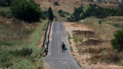 An Israeli soldier walks, amid ongoing cross-border hostilities between Hezbollah and Israeli forces, in Kiryat Shmona, northern Israel, June 4, 2024.