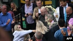 A person throws a drink in the face of Nigel Farage, newly appointed leader of Britain&#39;s right-wing populist party, Reform UK, during his general election campaign launch in Clacton-on-Sea, eastern England.