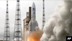 In this image provided by the European Space Agency, an Ariane rocket carrying the robotic explorer Juice takes off from Europe's Spaceport in French Guiana, April 14, 2023.