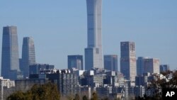 FILE - A view of Beijing's skyline from the Temple of Heaven park, Dec. 8, 2022. According to official statistics released by the government March 21, 2023, Beijing's population fell by 43,000, to 21.84 million, by the end of 2022.