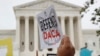 FILE - People rally outside the U.S. Supreme Court in Washington over President Donald Trump's decision to end the Deferred Action for Childhood Arrivals program, Nov. 12, 2019. 