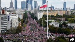 Thousands march to oppose the governing populist Law and Justice party in Warsaw, Poland, Oct. 1, 2023. Opposition leader Donald Tusk seeks to boost his election chances for parliamentary elections on Oct. 15. 