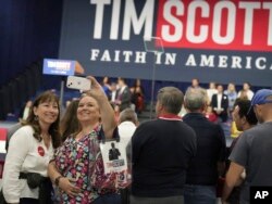 Supporters take selfies ahead of the presidential campaign launch of Senator Tim Scott, in North Charleston, South Carolina, May 22, 2023.