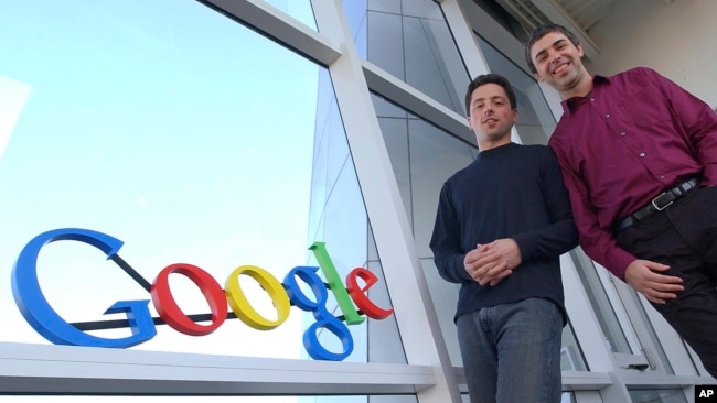 FILE - Google co-founders Sergey Brin, left, and Larry Page pose at company headquarters in Mountain View, California, Jan. 15, 2004.