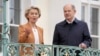 German Chancellor Olaf Scholz, right, welcomes European Commission President Ursula von der Leyen for a meeting as part of a two-day closed session of the German government at Meseberg Palace near Berlin, March 5, 2023.