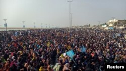 Supporters of the Balochistan Yakjehti Committee listen to the speech of their leader during what they call the Baloch National Gathering in Gwadar, Pakistan, July 28, 2024.