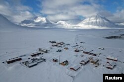 Houses are seen in the town of Ny-Aalesund, Svalbard, Norway, April 10, 2023.