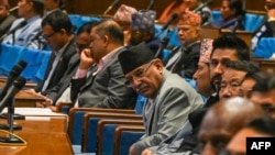 Nepal's Prime Minister Pushpa Kamal Dahal (C), looks on during a parliament session in Kathmandu on July 12, 2024.