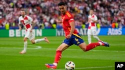FILE - Spain's Mikel Merino shoots during a Group B match between Spain and Croatia at the Euro 2024 soccer tournament in Berlin, Germany, June 15, 2024. Spain defeated Croatia 3-0. Spain plays Germany in the quarterfinals on Friday.