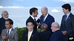 France's President Emmanuel Macron, top center left, with US President Joe Biden at the G7 Leaders' Summit in Hiroshima, western Japan, May 20, 2023.