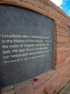 In this view through a fisheye lens, a plaque with a quote from President Bill Clinton is displayed on the wall of healing at the Columbine Memorial, April 17, 2024, in Littleton, Colorado. 