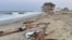 This photo provided by the National Park Service, Aug. 16, 2024, in Rodanthe, North Carolina, along the Cape Hatteras National Seashore shows debris from an unoccupied beach house that collapsed into the Atlantic Ocean from winds and waves caused by Hurricane Ernesto. 
