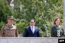 Armenian Defense Minister Suren Papikyan and US Ambassador to Armenia Kristina Kvien attend the opening ceremony of the joint Armenia-US military exercise, Eagle Partner 2024, in Yerevan, July 15, 2024. (Photo by handout / Armenian Defense Ministry / AFP)