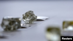 FILE - Diamonds are displayed at the De Beers Global Sightholder Sales (GSS) in Gaborone, Botswana, Nov. 24, 2015. 