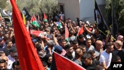 Palestinians carry the body of Othman Abu Khurog, 17, during his funeral procession at Zababdeh village near Jenin in the occupied West Bank, Aug. 22, 2023. 