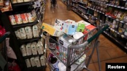 FILE: A shopping cart is seen in a supermarket as inflation affected consumer prices in Manhattan, New York City. Taken Jun. 10, 2022.