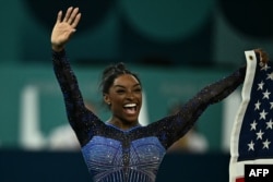 Gymnast Simone Biles of the U.S. celebrates winning the gold medal at the end of the artistic gymnastics women's all-around final of the 2024 Summer Olympics in Paris, Aug. 1, 2024.