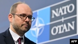 FILE - Then-Polish Undersecretary of State and now presidential adviser Marcin Przydacz is pictured as he arrives for an informal meeting of NATO Foreign Ministers on the conflict in Ukraine, in Berlin, Germany, May 14, 2022.