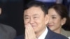 FILE - Mantan Perdana Menteri Thailand Thaksin Shinawatra menyapa para pendukungnya setibanya di bandara Don Muang di Bangkok, Thailand, Selasa, 22 Agustus 2023. (AP/Wason Wanichakorn)