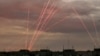 Paths of bullets are seen during a Russian drone strike in Kherson, Ukraine, July 26, 2024.