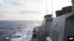 The Arleigh Burke-class guided-missile destroyer USS Milius (DDG 69) conducts routine underway operations in the South China Sea on March 24, 2023. (Greg Johnson/U.S. Navy/ via AP)