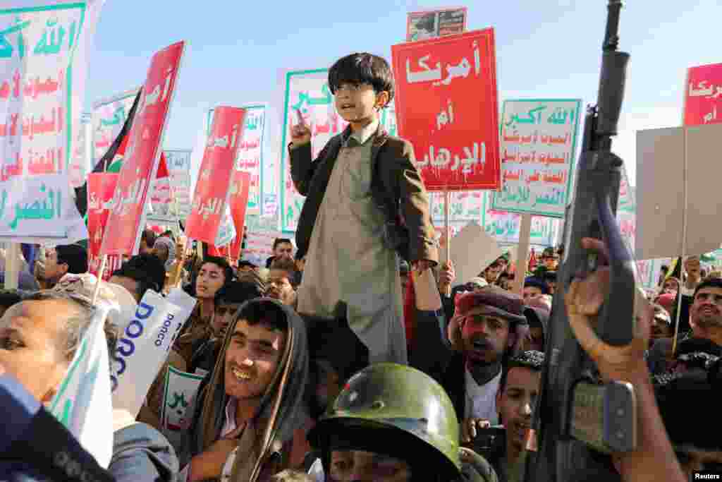 People supporting the Houthis protest in a rally against the U.S.-led strikes on Houthi targets and continued Israeli strikes in the Gaza Strip, in Sanaa, Yemen.