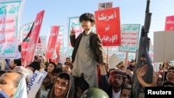 FILE - People supporting the Houthis gather in a rally, in Sanaa, Yemen, Jan. 26, 2024.