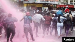 People run after police use water cannon to disperse protesters during a demonstration against Kenya's proposed finance bill in Nairobi, Kenya, June 20, 2024.