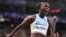 Saint Lucia's Julien Alfred celebrates winning the women's 100m final of the athletics event at the Paris 2024 Olympic Games at Stade de France in Saint-Denis, north of Paris, Aug. 3, 2024. 
