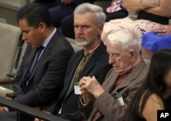 Yaroslav Hunka, right, sits in Canada's House of Commons in Ottawa, Onatario, Sept. 22, 2023. (Patrick Doyle/The Canadian Press/via AP)